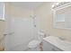Bathroom featuring a shower, white tiling, and a grey vanity at 6850 S Biscayne Dr, North Port, FL 34287