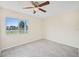 Bedroom featuring a ceiling fan, natural light, and tile floors at 6850 S Biscayne Dr, North Port, FL 34287