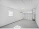 Garage featuring white walls and epoxy flooring at 6850 S Biscayne Dr, North Port, FL 34287
