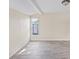 Bright living room with neutral walls, tile floors, and natural light at 6850 S Biscayne Dr, North Port, FL 34287