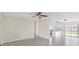 Spacious living area featuring tile flooring, and an open layout connecting to the kitchen at 6850 S Biscayne Dr, North Port, FL 34287