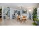 Bright dining area features a ceiling fan and nautical decor adjacent to the kitchen at 7231 Elyton Dr, North Port, FL 34287