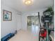 Bright exercise room featuring an elliptical machine, fitness equipment, and neutral tile flooring at 7231 Elyton Dr, North Port, FL 34287