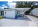 The side view of the home has a single car garage and a covered patio at 7231 Elyton Dr, North Port, FL 34287