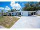 Charming single-story home with a blue exterior, well-kept lawn, attached garage and white trim at 7231 Elyton Dr, North Port, FL 34287