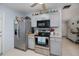 Kitchen with neutral cabinets, stainless appliances, and decor at 7231 Elyton Dr, North Port, FL 34287