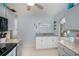Bright kitchen featuring neutral cabinets and decor at 7231 Elyton Dr, North Port, FL 34287
