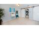 Living area with seating, desk, decor and barn doors opening to the kitchen at 7231 Elyton Dr, North Port, FL 34287