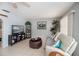 Living area featuring neutral tones, tile flooring, ceiling fan and backyard views at 7231 Elyton Dr, North Port, FL 34287