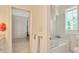 Bright bathroom showcasing a tiled bathtub and shower combination at 936 Hemingway Cir, Tampa, FL 33602