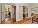 Elegant entryway with hardwood floors, a grandfather clock, and a view of the outdoor porch at 936 Hemingway Cir, Tampa, FL 33602