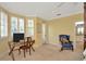 Bedroom featuring a desk, chair and sitting area with television, pillows, and shuttered window at 936 Hemingway Cir, Tampa, FL 33602