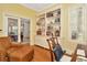 Home office featuring a built-in bookcase, a window, and hardwood flooring at 936 Hemingway Cir, Tampa, FL 33602