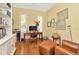 Bright home office with hardwood floors, built-in bookshelves, desk, and sitting area at 936 Hemingway Cir, Tampa, FL 33602
