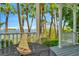Relaxing porch with water views, perfect for enjoying the outdoors and the beautiful scenery at 936 Hemingway Cir, Tampa, FL 33602