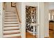 Staircase leading to the second floor adjacent to a stylish half-bath at 936 Hemingway Cir, Tampa, FL 33602