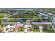 Aerial view of waterfront homes along a canal, showcasing neighborhood layout and access to waterways at 9582 Arsipe Cir, Port Charlotte, FL 33981