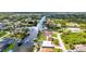 Aerial shot showcases waterfront community with lush landscape, boating access, and serene atmosphere at 9582 Arsipe Cir, Port Charlotte, FL 33981