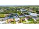 Waterfront community with houses lining the canals and beautiful landscaping throughout at 9582 Arsipe Cir, Port Charlotte, FL 33981