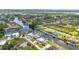 A high-angle view showcasing homes nestled alongside serene waterways in a residential neighborhood setting at 9582 Arsipe Cir, Port Charlotte, FL 33981