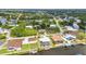 Expansive aerial perspective of waterfront properties with landscaped yards and tranquil canals in a neighborhood at 9582 Arsipe Cir, Port Charlotte, FL 33981