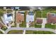 Aerial view of waterfront homes, driveways, lush landscaping, and private pools at 9582 Arsipe Cir, Port Charlotte, FL 33981