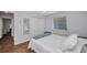 Relaxing bedroom features a queen bed, closet and a view to the side yard with natural lighting at 9582 Arsipe Cir, Port Charlotte, FL 33981