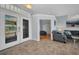 Welcoming foyer features tiled floors, leading to a living area and an office at 9582 Arsipe Cir, Port Charlotte, FL 33981