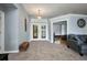 Welcoming foyer features tiled floors, leading to a living area and an office with a bay window at 9582 Arsipe Cir, Port Charlotte, FL 33981