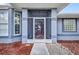 Charming home entry with a screened-in porch and decorative security screen door at 9582 Arsipe Cir, Port Charlotte, FL 33981