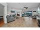 Inviting living room with comfortable seating, tiled floors, and seamless access to the pool area at 9582 Arsipe Cir, Port Charlotte, FL 33981