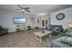 Comfortable living room featuring tile floors, ceiling fan and coastal decor at 9582 Arsipe Cir, Port Charlotte, FL 33981