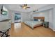 Bright bedroom features tile flooring, pool views, and plenty of natural light at 9582 Arsipe Cir, Port Charlotte, FL 33981