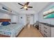 The spacious main bedroom features tile flooring, ensuite bathroom and pool view at 9582 Arsipe Cir, Port Charlotte, FL 33981
