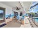 Enclosed pool area with mural wall design, ceiling fan, and patio dining set at 9582 Arsipe Cir, Port Charlotte, FL 33981