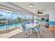 Enclosed pool area with patio furniture, ceiling fan, and mural wall design at 9582 Arsipe Cir, Port Charlotte, FL 33981