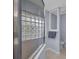 Shower features glass block window for light and privacy in the ensuite bathroom at 9582 Arsipe Cir, Port Charlotte, FL 33981