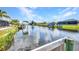 Scenic waterfront view of the canal featuring docks and boat lifts at 9582 Arsipe Cir, Port Charlotte, FL 33981