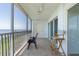 This screened balcony provides a relaxing space with serene water views, ceiling fan, and comfortable seating at 101 N Marion Ct # 133, Punta Gorda, FL 33950