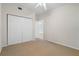 Carpeted bedroom with double door closet and door to the rest of the home at 101 N Marion Ct # 133, Punta Gorda, FL 33950