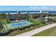 Coastal condo community featuring manicured grounds, tennis courts, lush landscaping, and beautiful ocean views at 101 N Marion Ct # 133, Punta Gorda, FL 33950