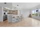 Bright kitchen features stainless steel appliances, modern countertops, and bar seating with view at 101 N Marion Ct # 133, Punta Gorda, FL 33950