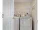 A laundry room featuring a standard white washer and dryer at 101 N Marion Ct # 133, Punta Gorda, FL 33950
