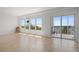 Bright living room boasts natural light, tiled floors, and access to an outdoor balcony overlooking the ocean at 101 N Marion Ct # 133, Punta Gorda, FL 33950