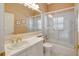 Bathroom with tub, shower, single sink vanity and a large framed mirror at 10263 Shadow Run Cir, Punta Gorda, FL 33955