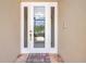 A welcoming front door with decorative glass and a welcome mat at 10263 Shadow Run Cir, Punta Gorda, FL 33955