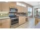 Well-equipped kitchen with stainless steel appliances and ample cabinet space at 10263 Shadow Run Cir, Punta Gorda, FL 33955