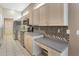 Kitchen boasting stainless steel appliances and a decorative tile backsplash at 10263 Shadow Run Cir, Punta Gorda, FL 33955