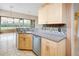 Kitchen with stainless steel dishwasher, sink, and ample counter space at 10263 Shadow Run Cir, Punta Gorda, FL 33955