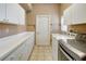 Convenient laundry room with ample counter space and modern appliances at 10263 Shadow Run Cir, Punta Gorda, FL 33955